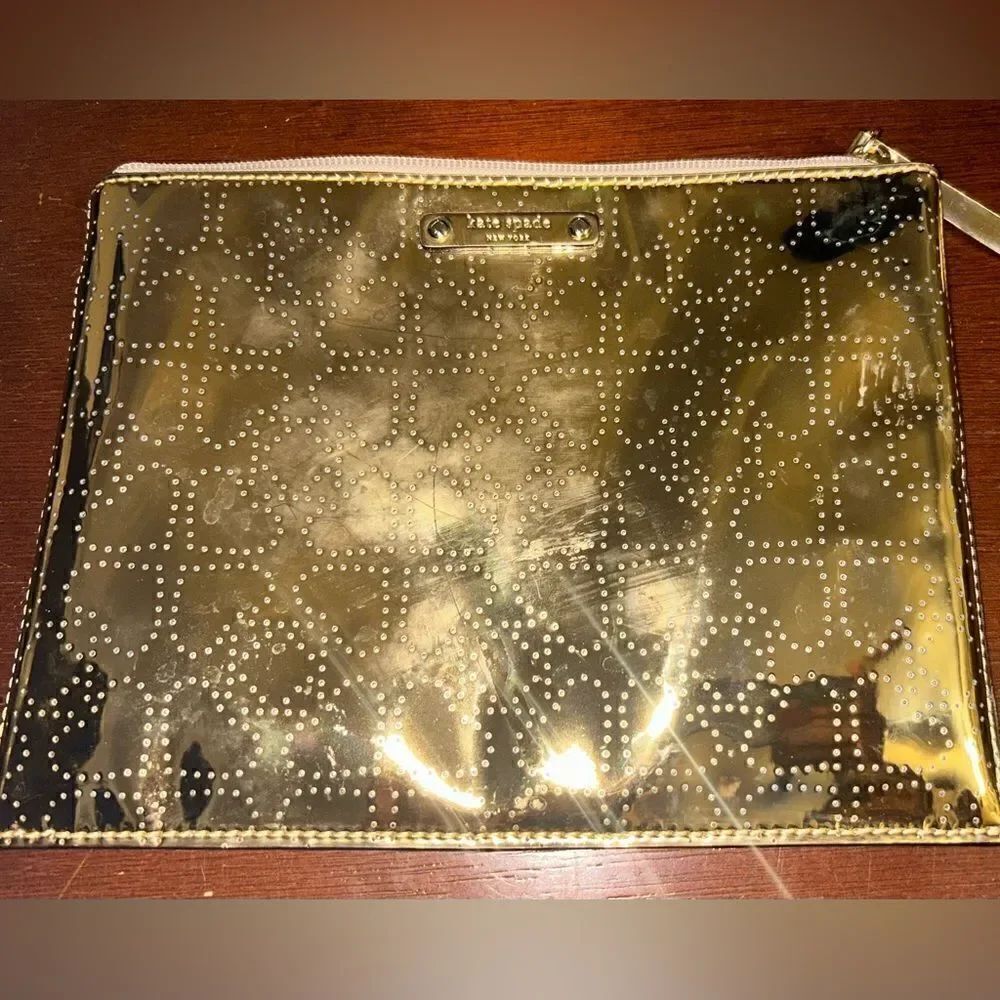Authentic Kate Spade shiny gold travel bag or clutch